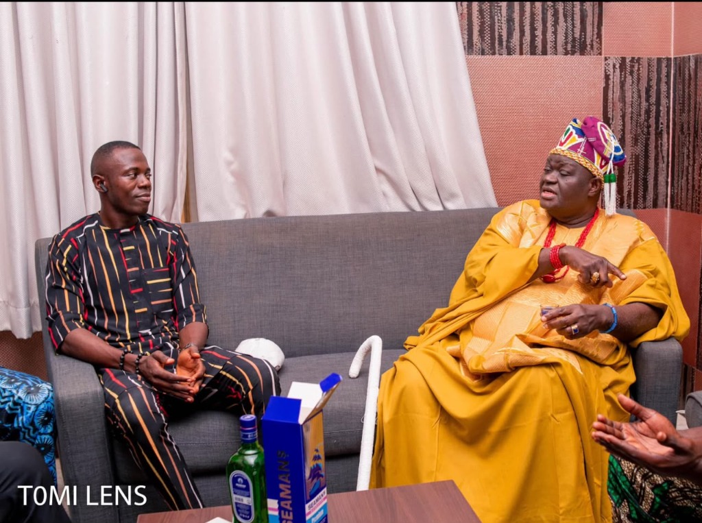 OmoAkin seated in dialogue with His Royal Majesty Oba Dr. Michael Odunayo Ajayi, Arowotawaya II, The Elerinmo of Erinmo-Ijesha