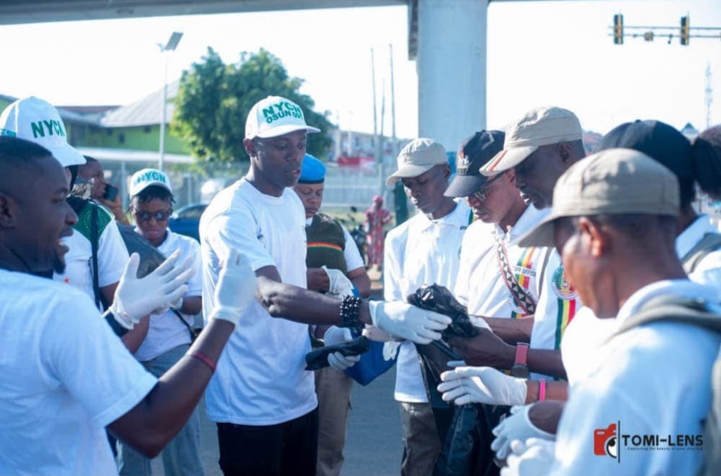 OmoAkin and NYCN youth executives leading environmental sanitation and community clean-up