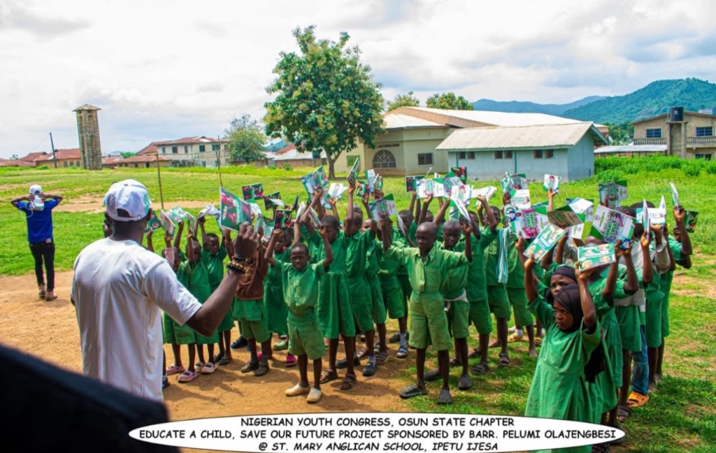 Pupils of St. Mary Anglican School, Ipetu Ijesa celebrating received learning materials