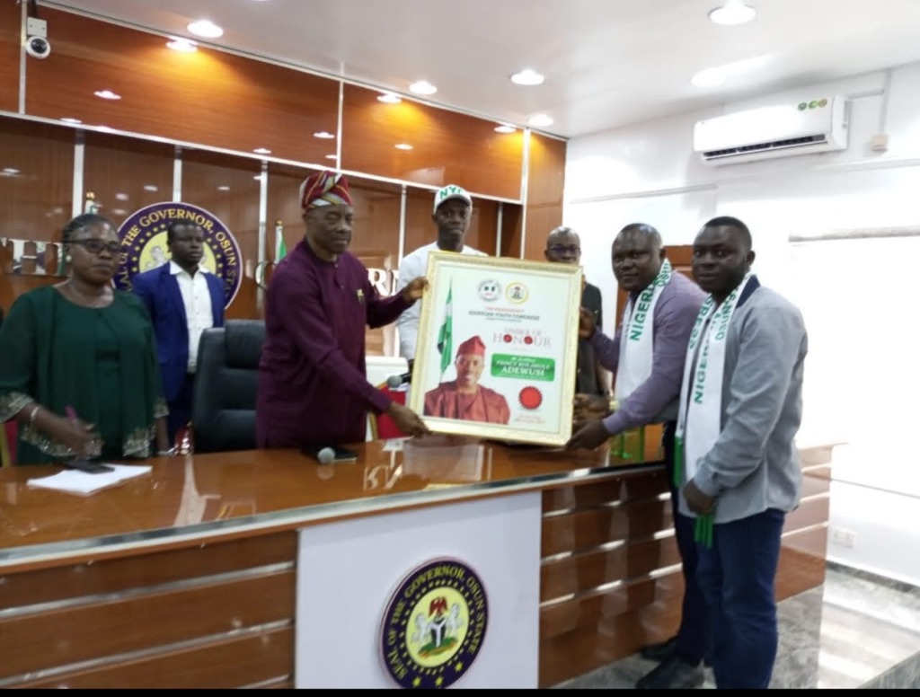 OmoAkin and youth executives presenting the Symbol of Honour framed citation in the Osun State Governor's Office