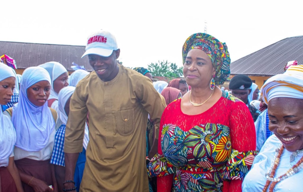 OmoAkin walking alongside the Wife of the Governor of Osun State during school community outreach